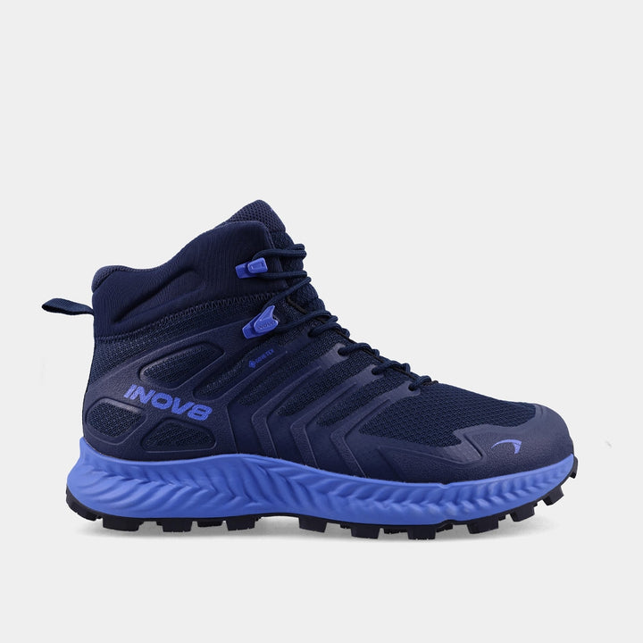 Dark blue hiking boot with a light blue sole and a visible Inov8 logo on a white background