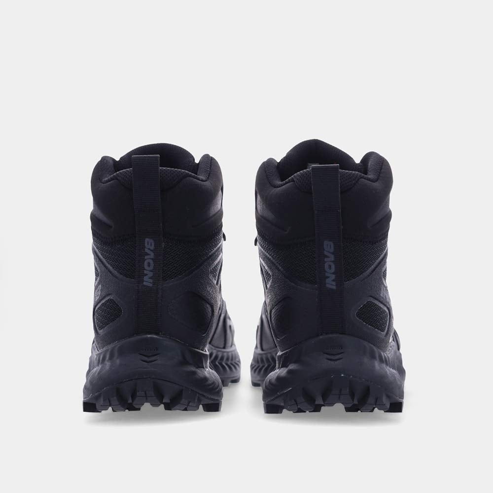 Black hiking boots viewed from behind on a white background