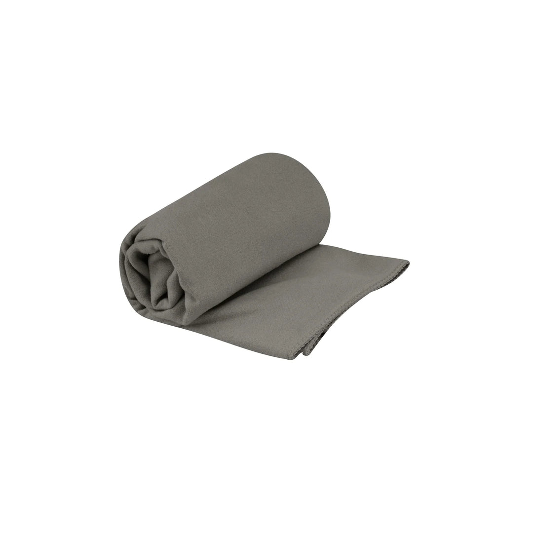 Rolled-up gray towel on a white background