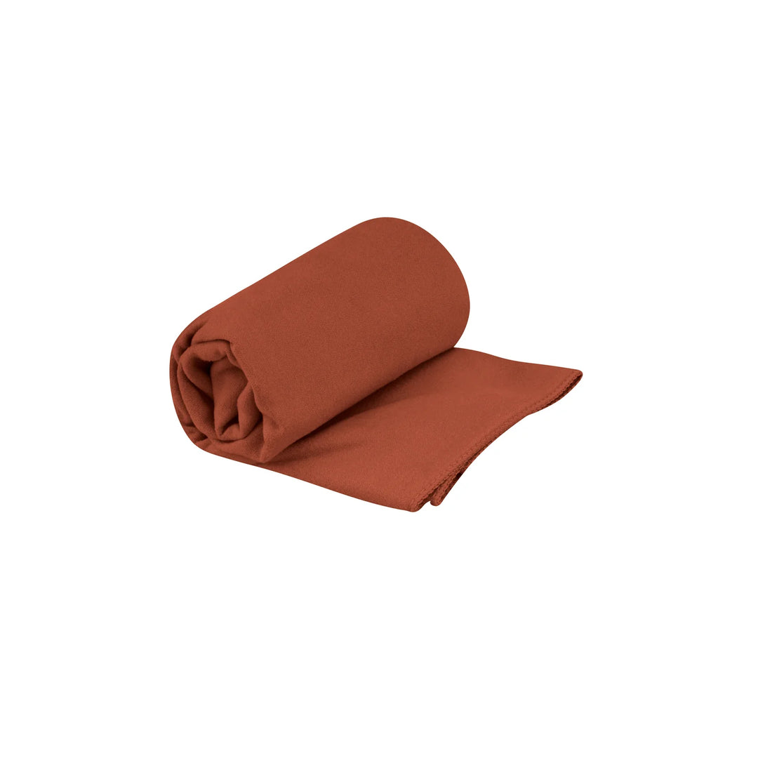 Rolled-up brown towel on a white background