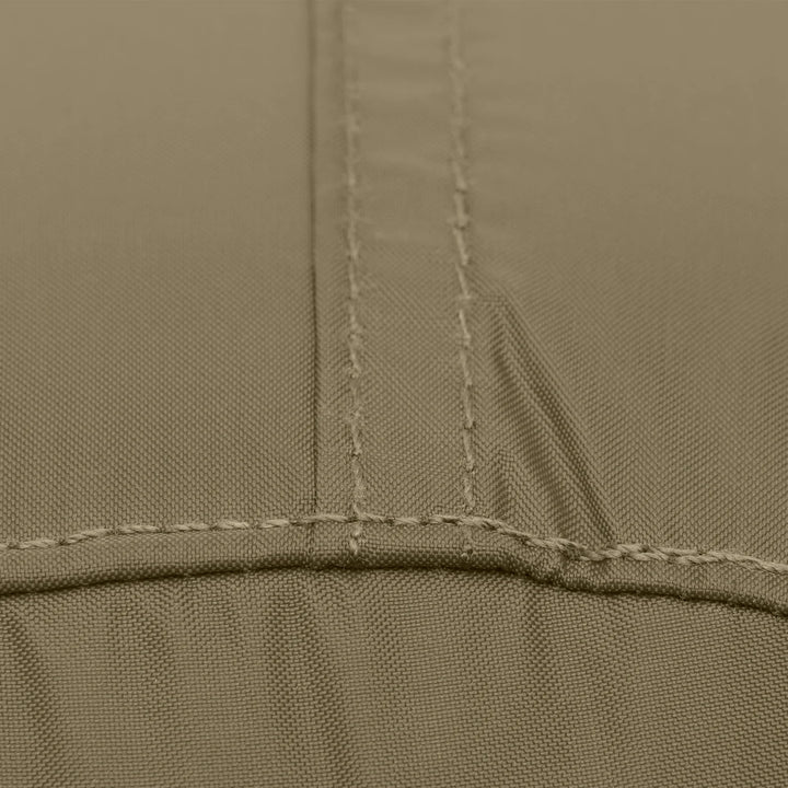 Close-up of a fabric surface in a muted taupe-beige color, showing stitched seams and a fine woven texture.
