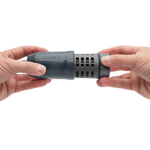 Close up of a grey water filter with cartridge partially removed