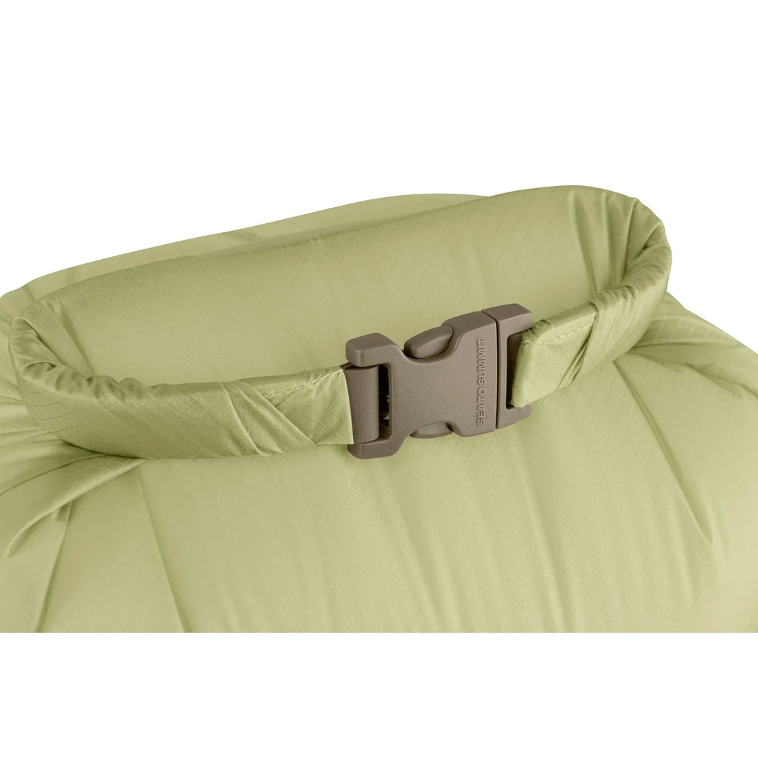 Close-up of a green inflatable bag with a buckle on a white background