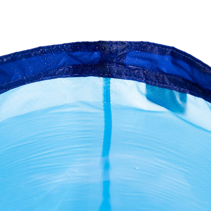 Close up of the inside rim of a nylon collapsible bucket, adorned with water droplets