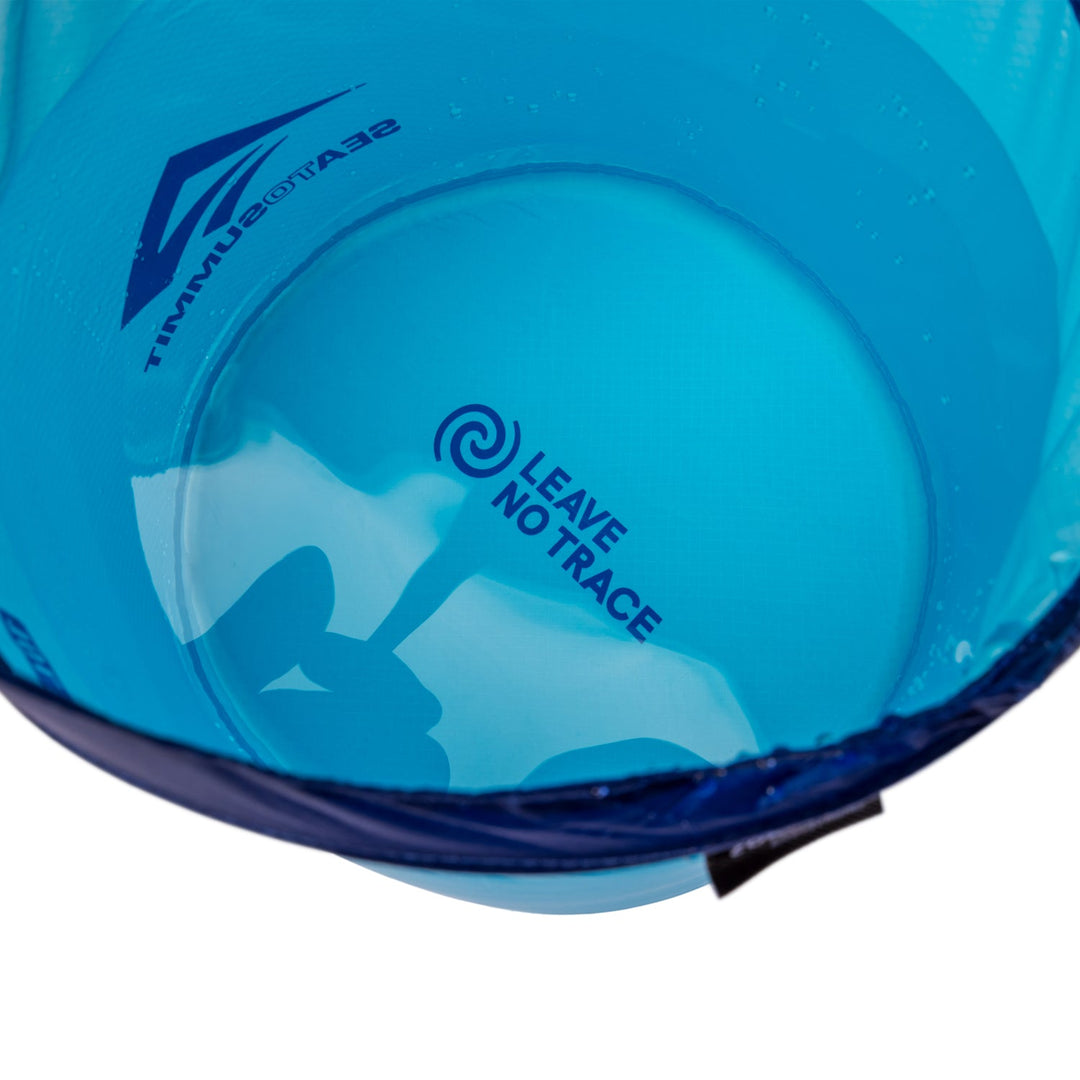 Bottom of collapsible bucket seen through water and showing "Leave no trace" logo