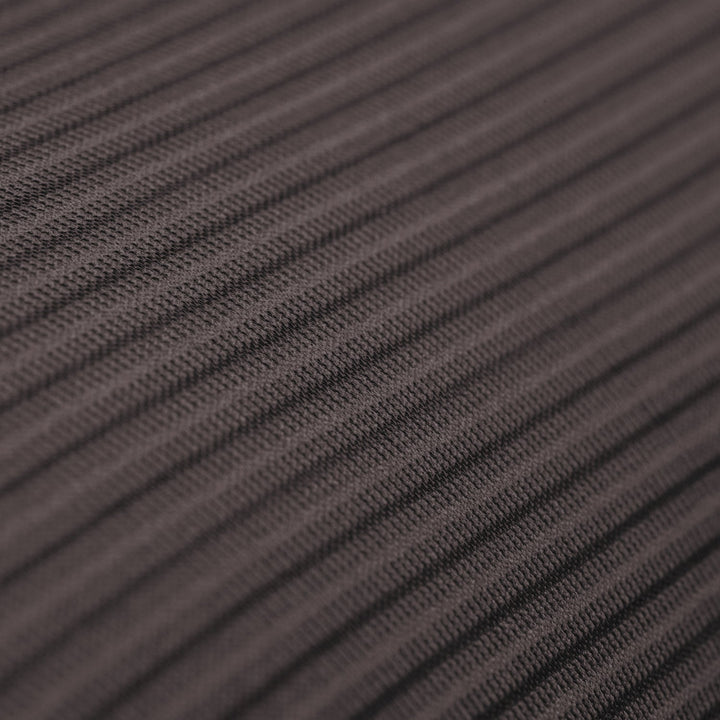 Close up of the surface of a dark gray ribbed textile