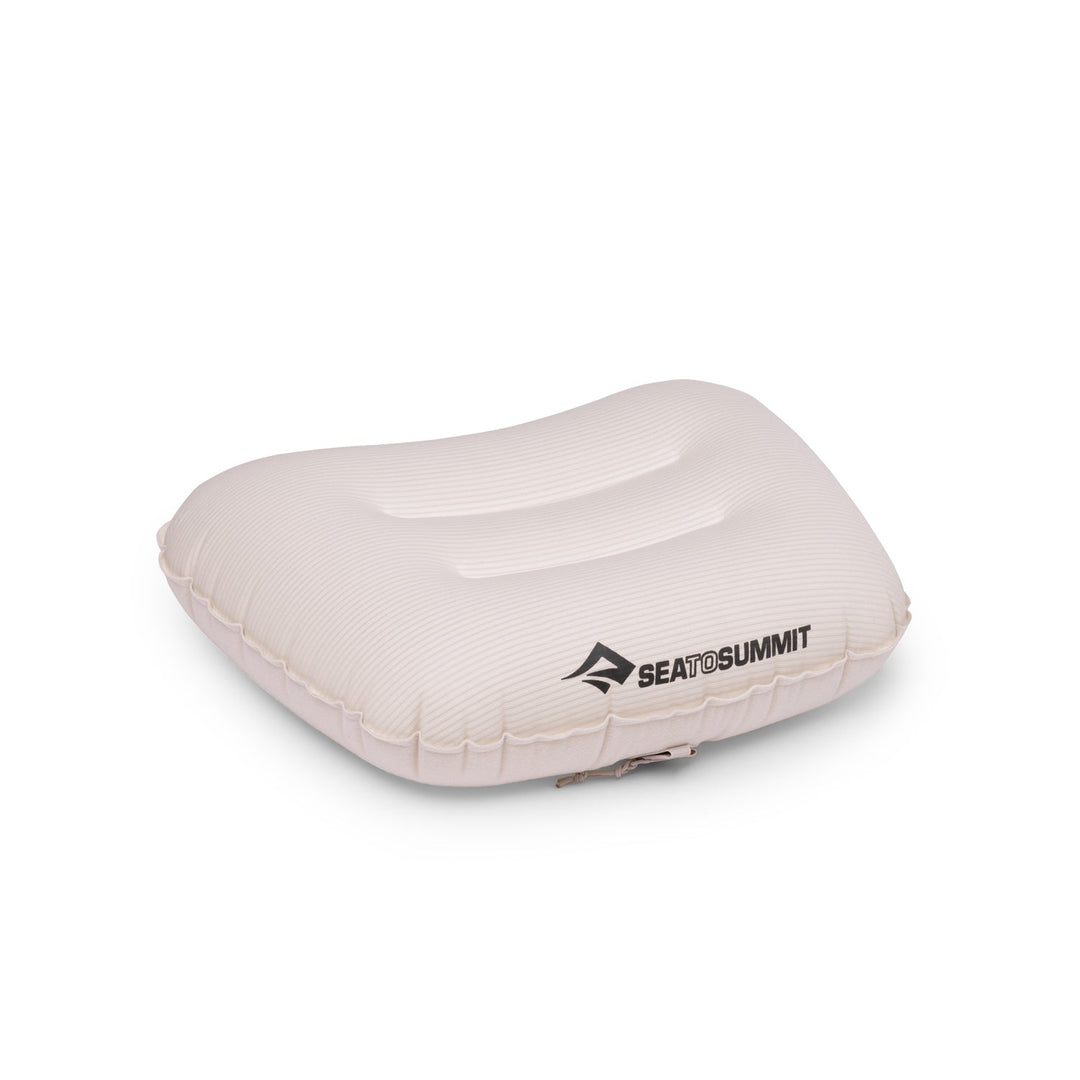 Pale pink inflatable pillow with Sea to Summit logo on a white background