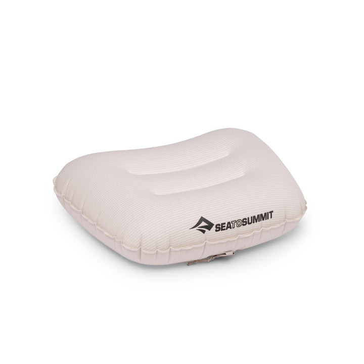 Pale pink inflatable pillow with Sea to Summit logo on a white background