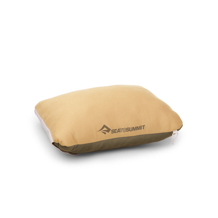 Beige pillow with Sea to Summit logo on a white background