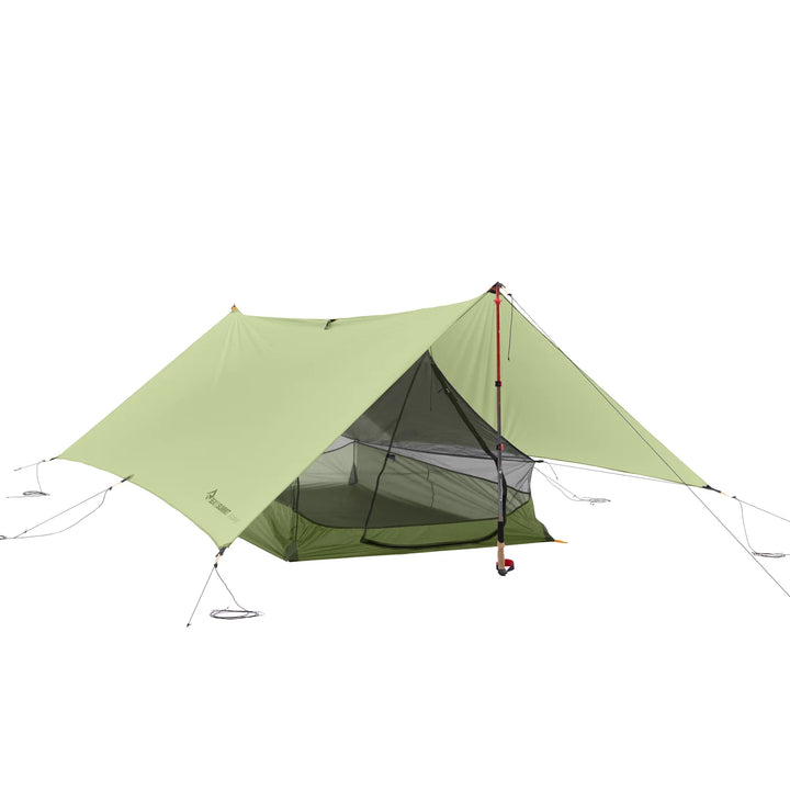 Green camping tent on a white background