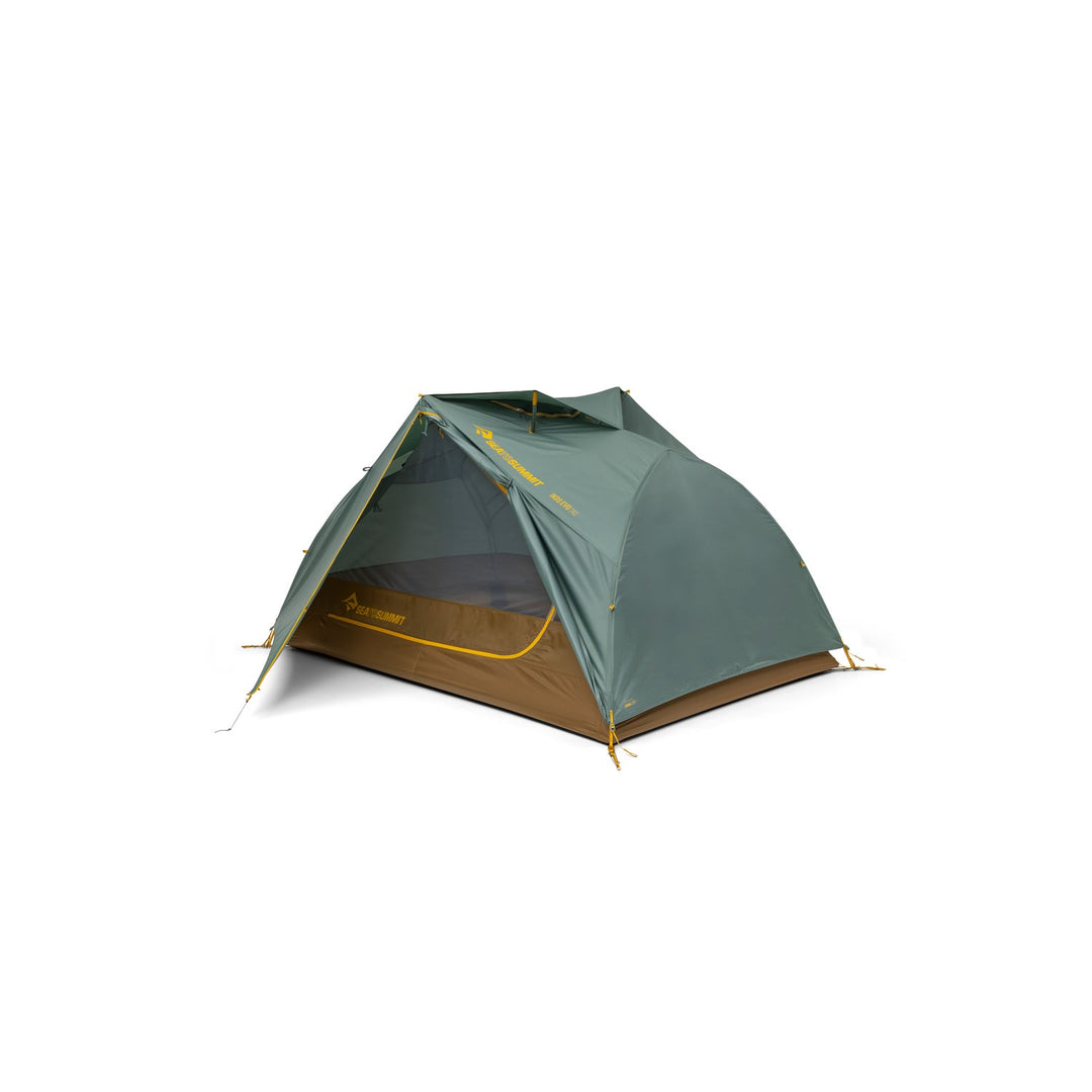 Green and brown tent with open door on a white background.