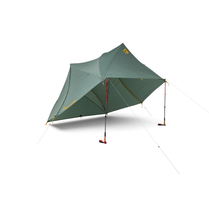 Green tent fly elevated by two hiking poles on a white background.