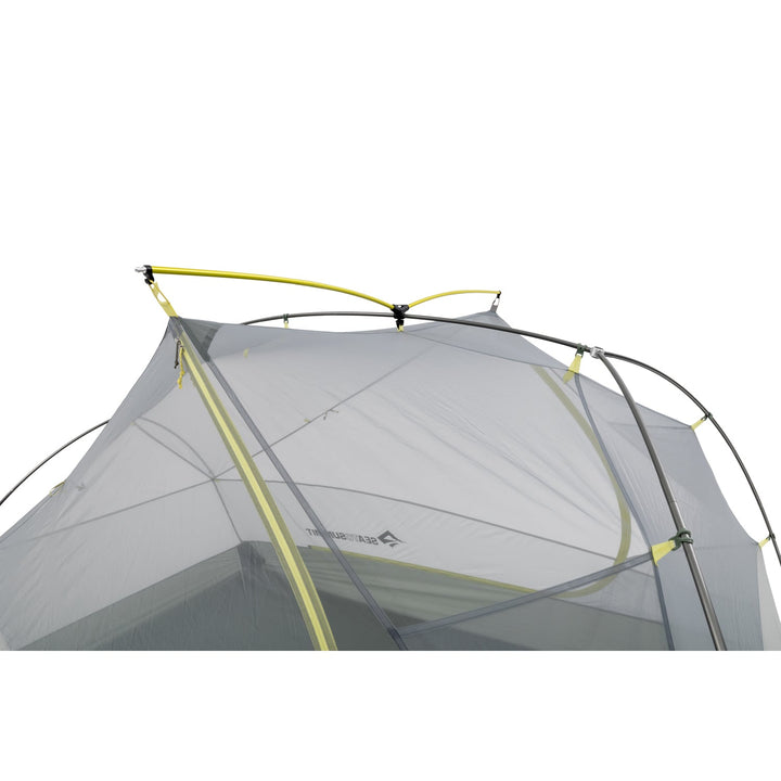 Close up of grey mesh tent inner with light green poles.