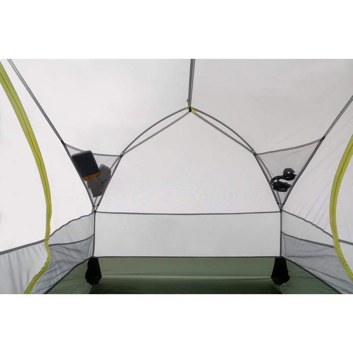 Inside of grey tent with light green zips and mesh pockets.