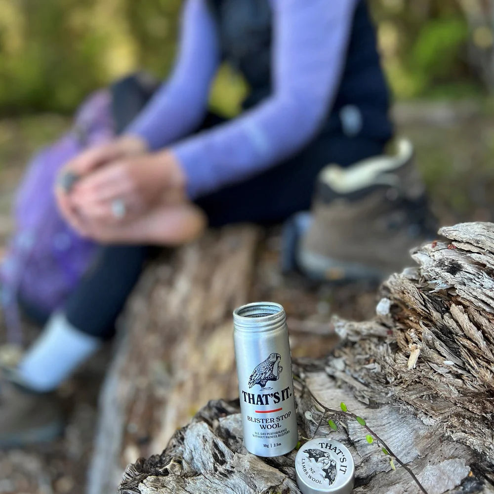 Person sitting outdoors with a can of &