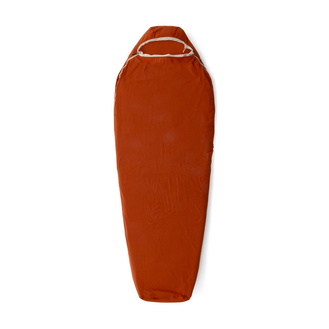 Red sleeping bag liner on a white background