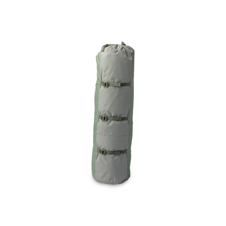 Light green packed up tent on white background 