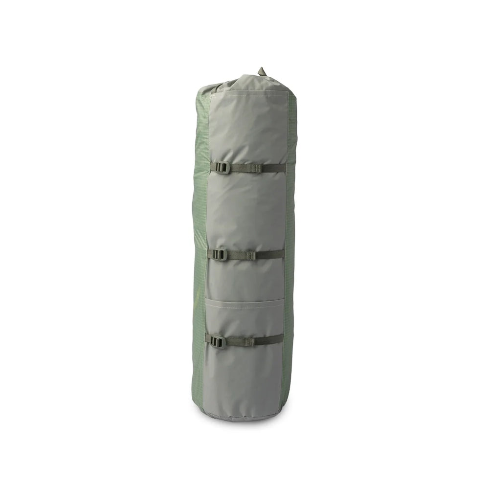 Light green packed up camping tent on a white background 
