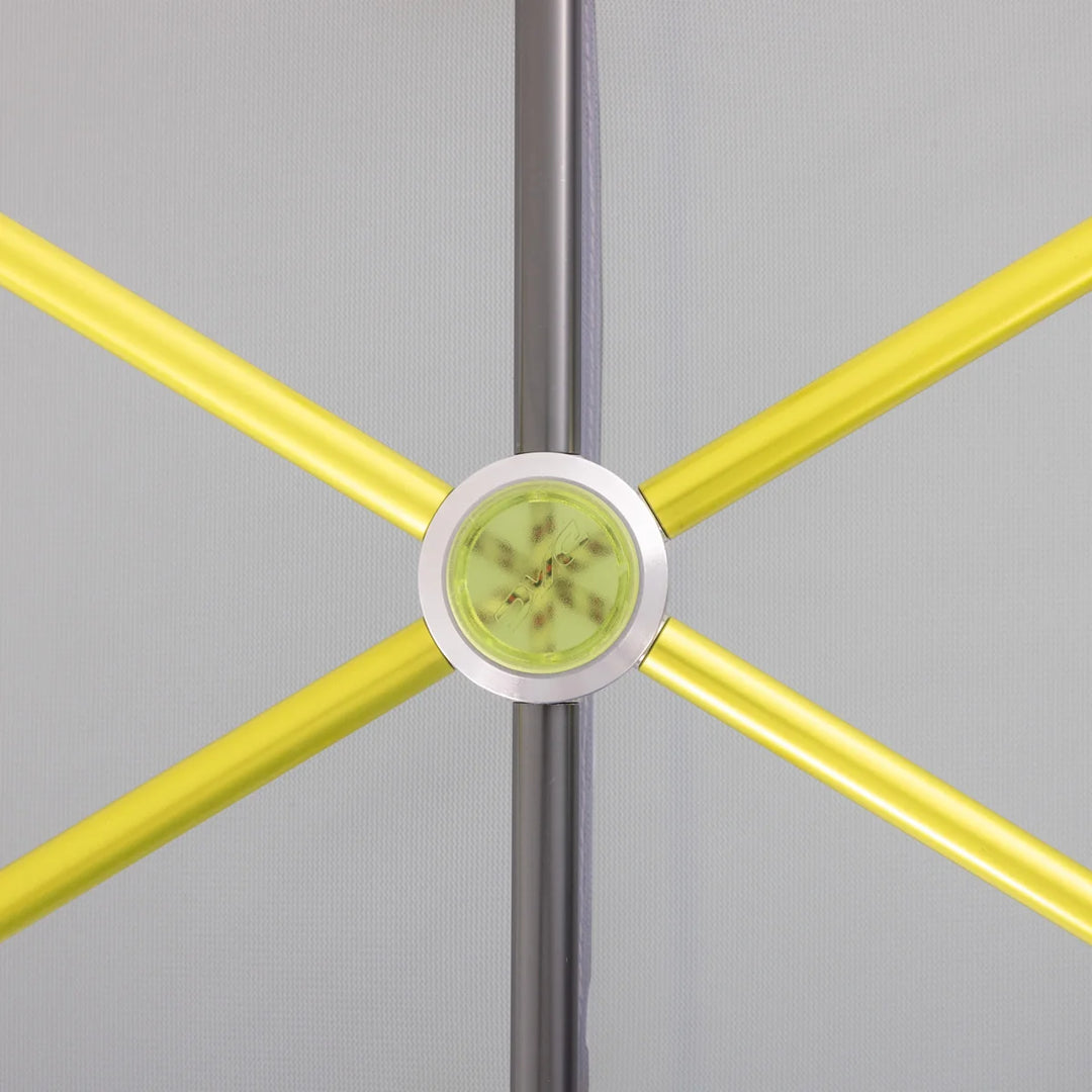 Close up of a yellow DAC tent pole joining with a silver tent pole behind on a light grey background 