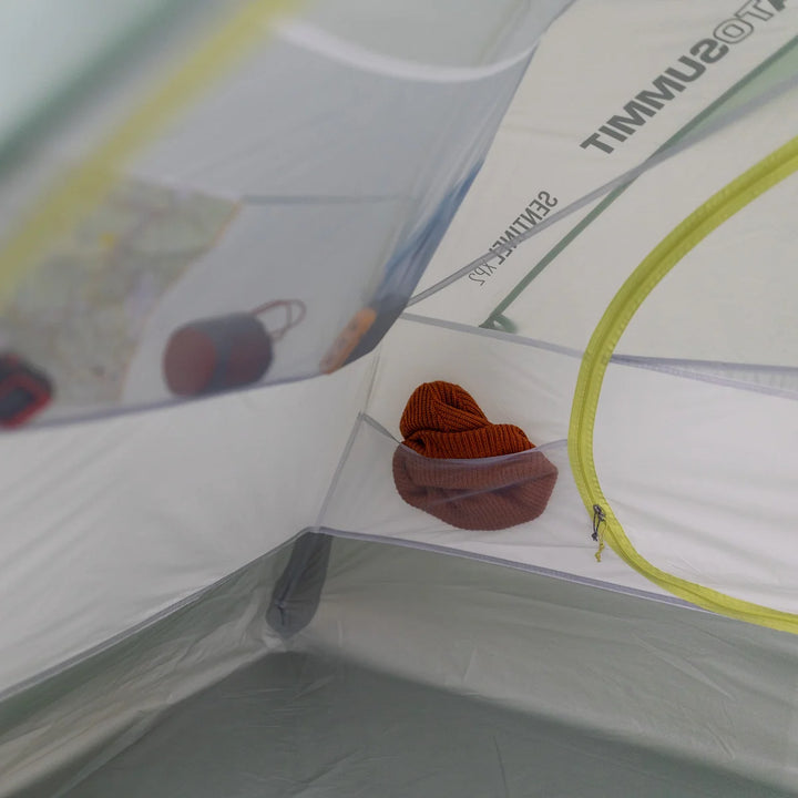 Tent interior with a small bag inside, featuring the brand &