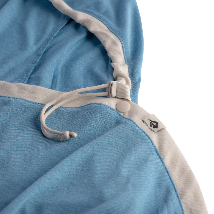 Close-up of a blue and beige fabric with a drawstring and brand logo on a white background