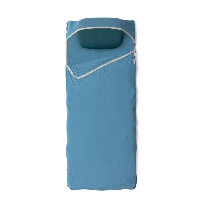 Blue sleeping bag liner with white trim on a white background
