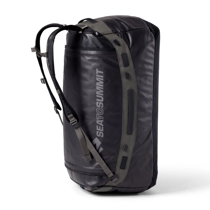 A black Sea to Summit backpack shown from a three-quarter angle on a white background, featuring gray compression straps and a vertical white brand logo.