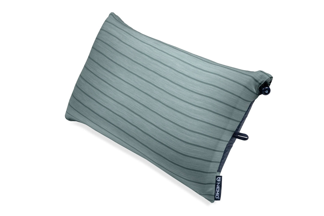 Green travel pillow on a white background