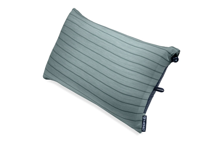 Green travel pillow on a white background