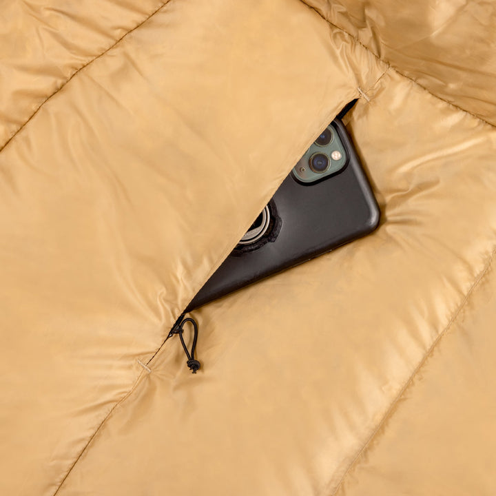 Phone half inside a zip pocket on the inside of sleeping bag