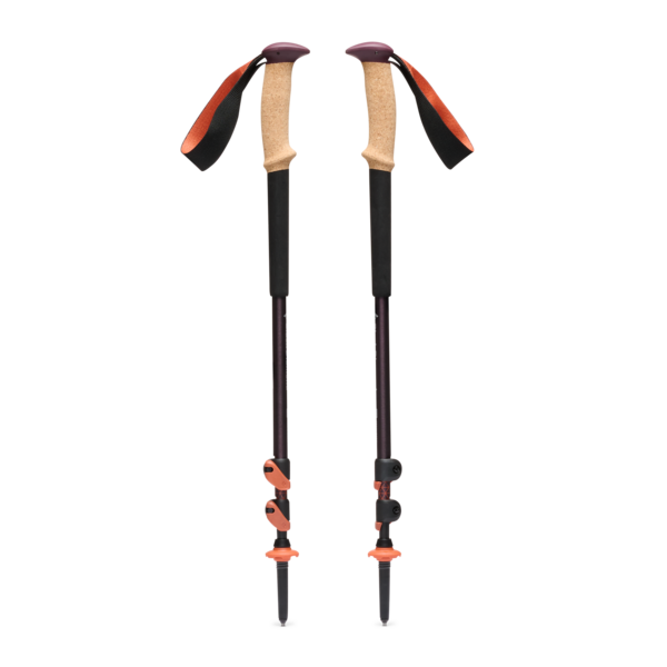 Pair of purple hiking poles with cork grips, collapsed, on a white background