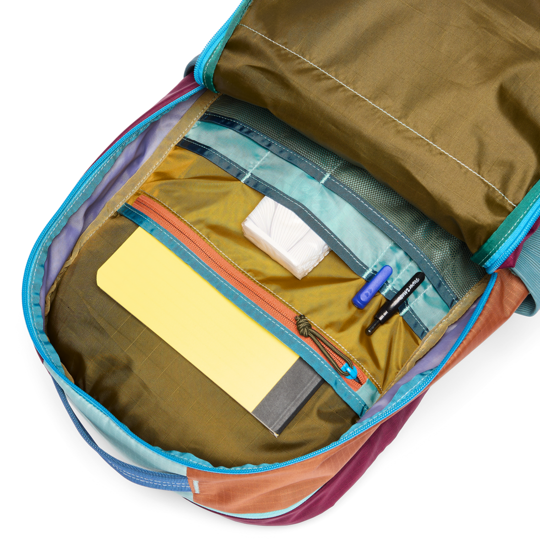 Multicolored backpack with organized compartments on a white background
