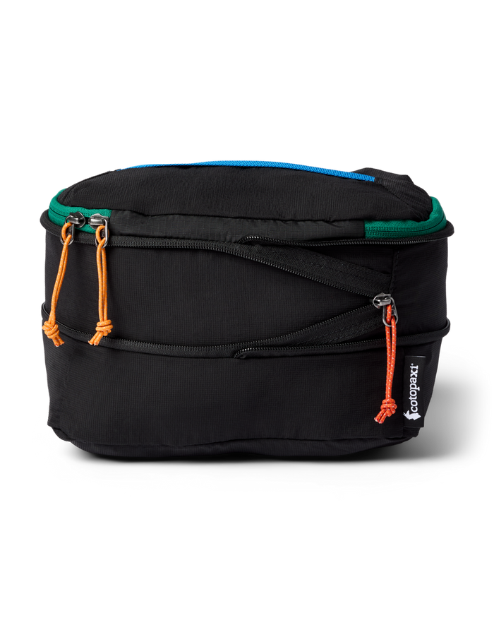 Black packing cube with colourful zippers on a white background