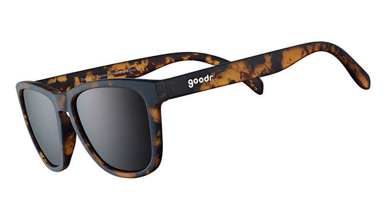 Sunglasses with tortoiseshell frame and dark lenses on a white background