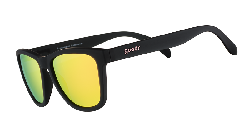 Black sunglasses with yellow lenses on a white background