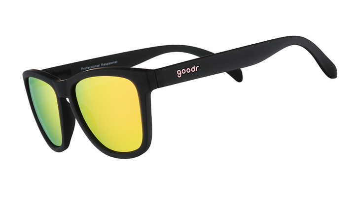 Black sunglasses with yellow lenses on a white background