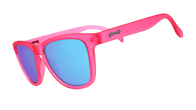 Pink sunglasses with blue lenses on a white background