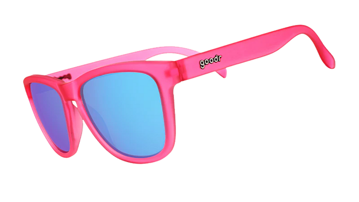 Pink sunglasses with blue lenses on a white background