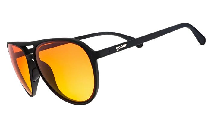 Sunglasses with orange lenses and black frame on a white background
