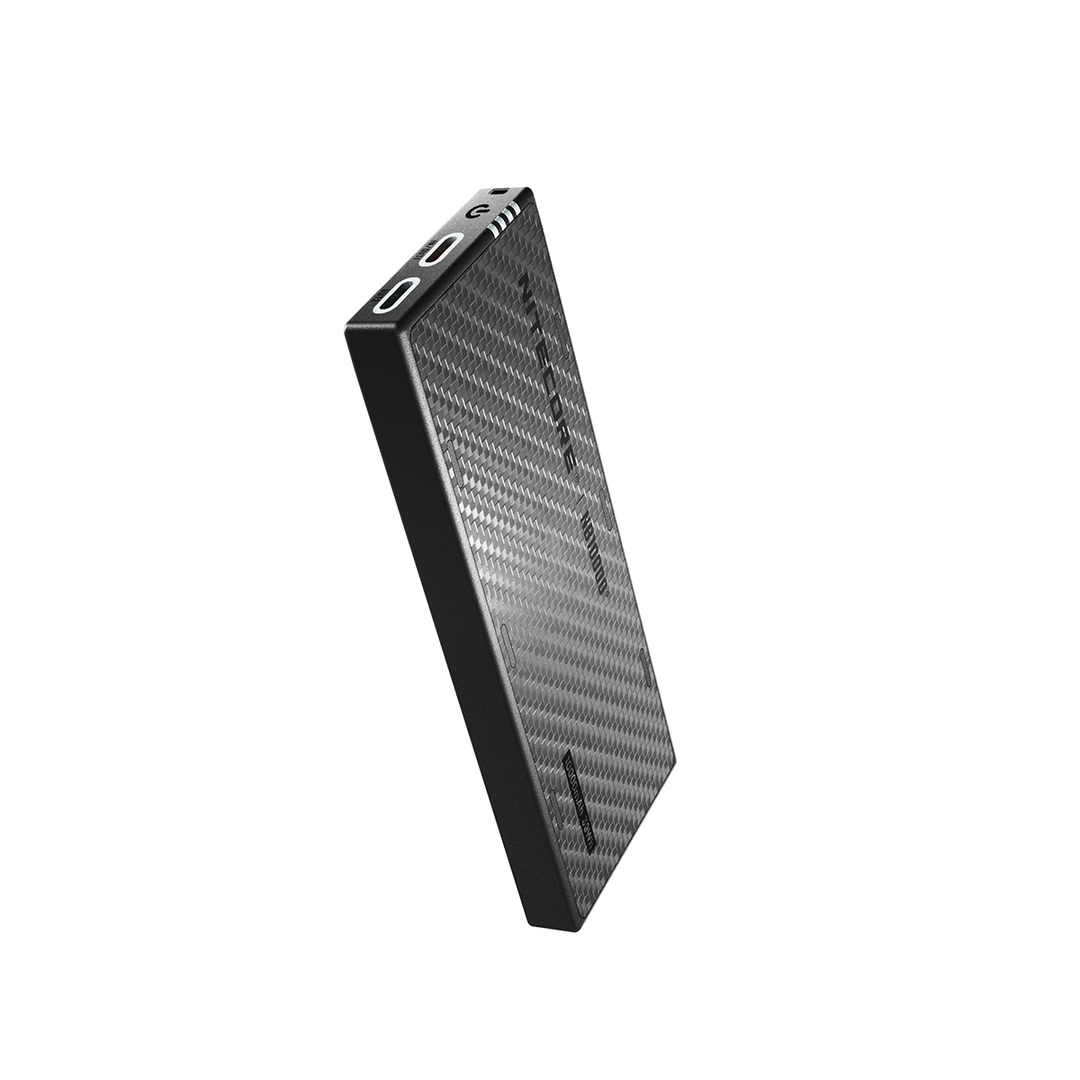 Black portable power bank with carbon fiber texture on a white background