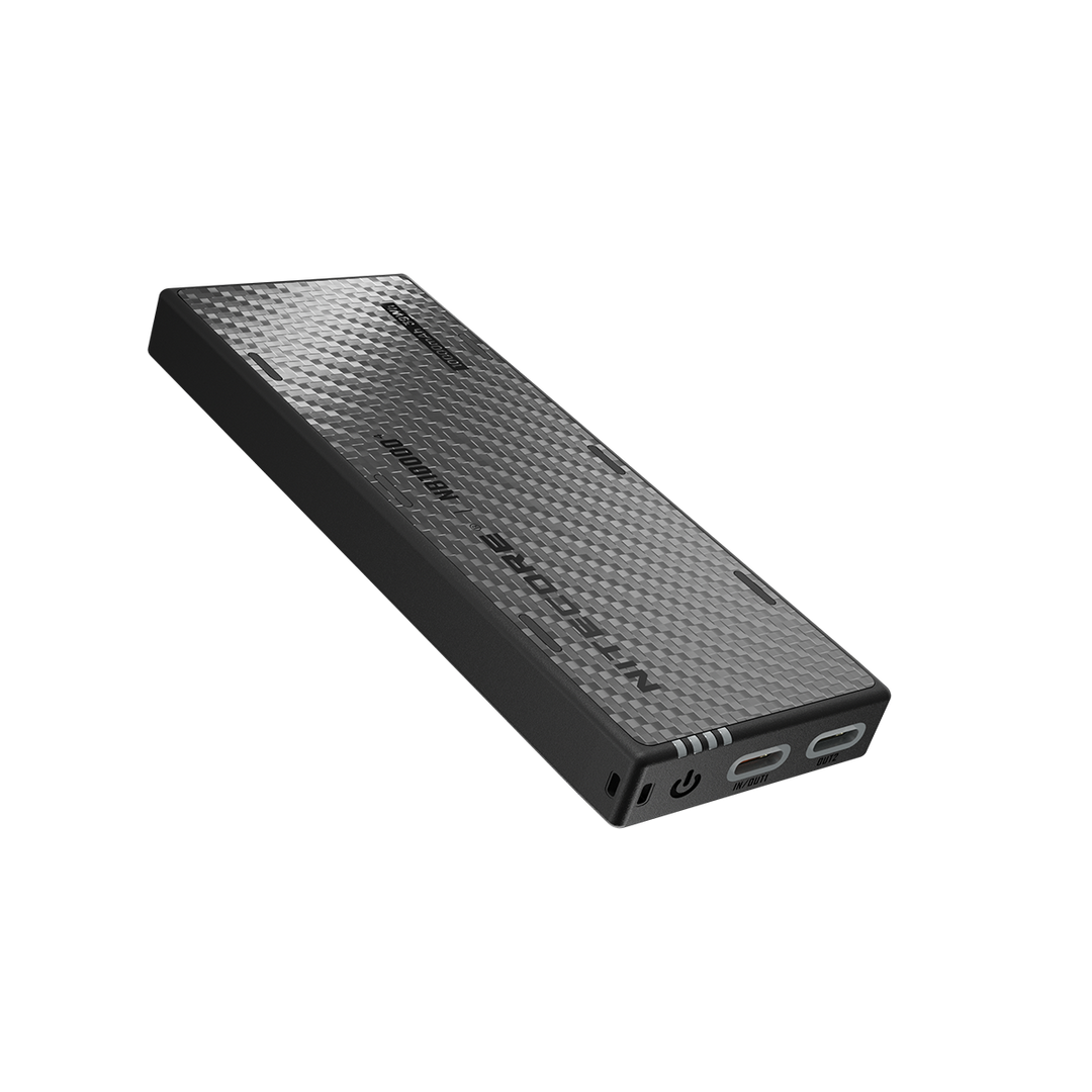 Black power bank with textured surface on a white background