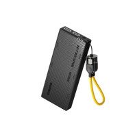 Black power bank with USB cable on a white background