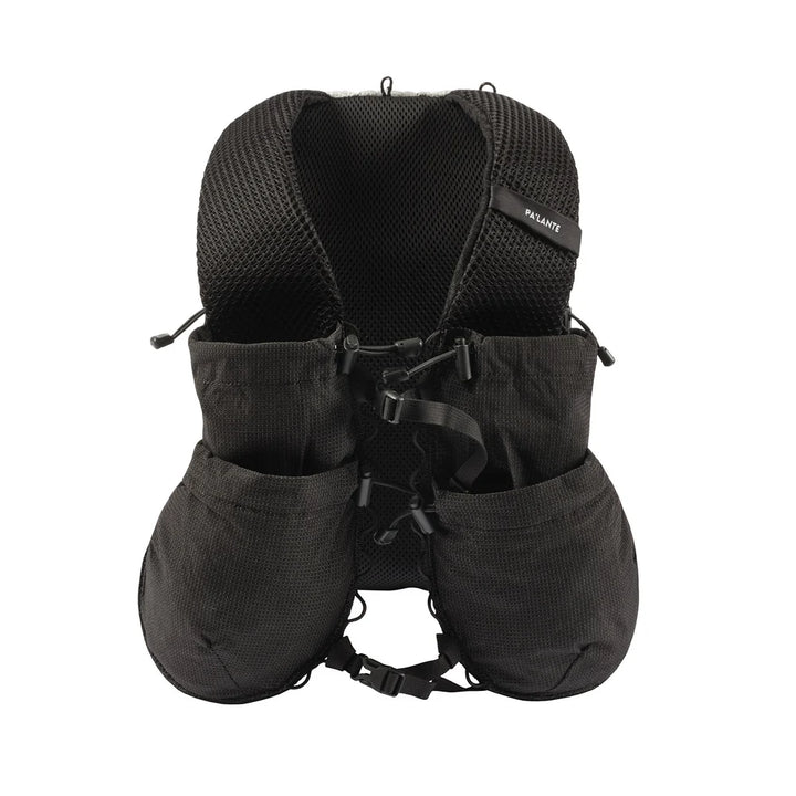 Black backpack style vest with multiple pockets and straps on a white background