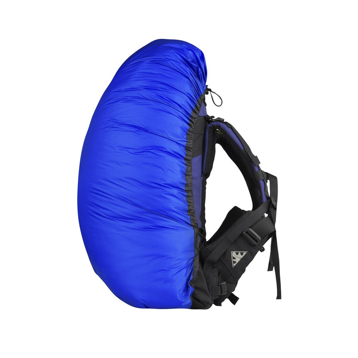 Blue pack cover on a small hiking pack