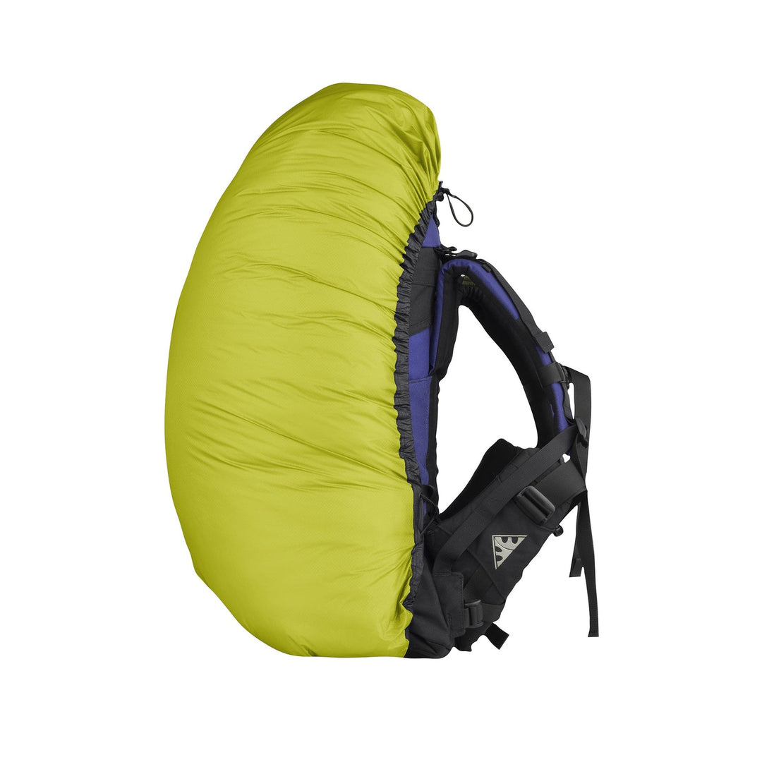 Lime green backpack cover on a small hiking pack