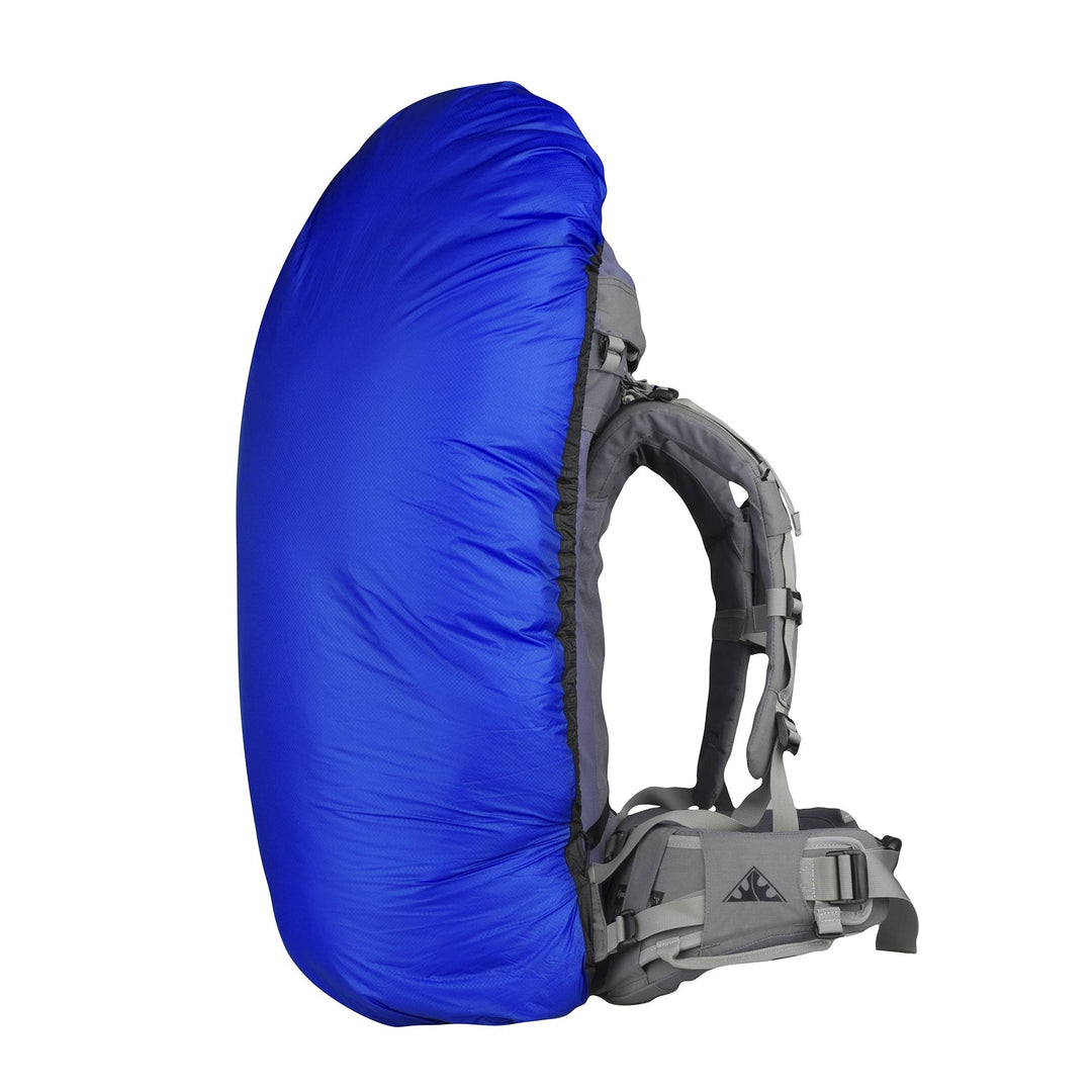 Blue pack cover on large hiking pack