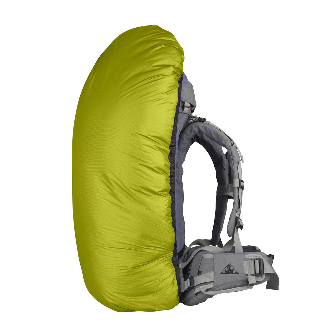 Lime green pack cover on a large hiking pack