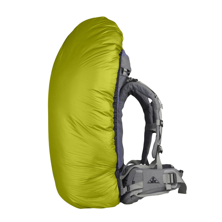 Lime green pack cover on a large hiking pack