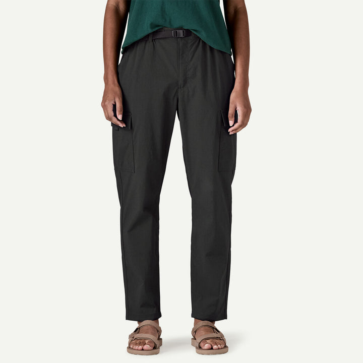 Person wearing black pants on a white background