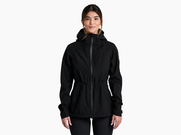 Woman wearing a black rain coat on a white background